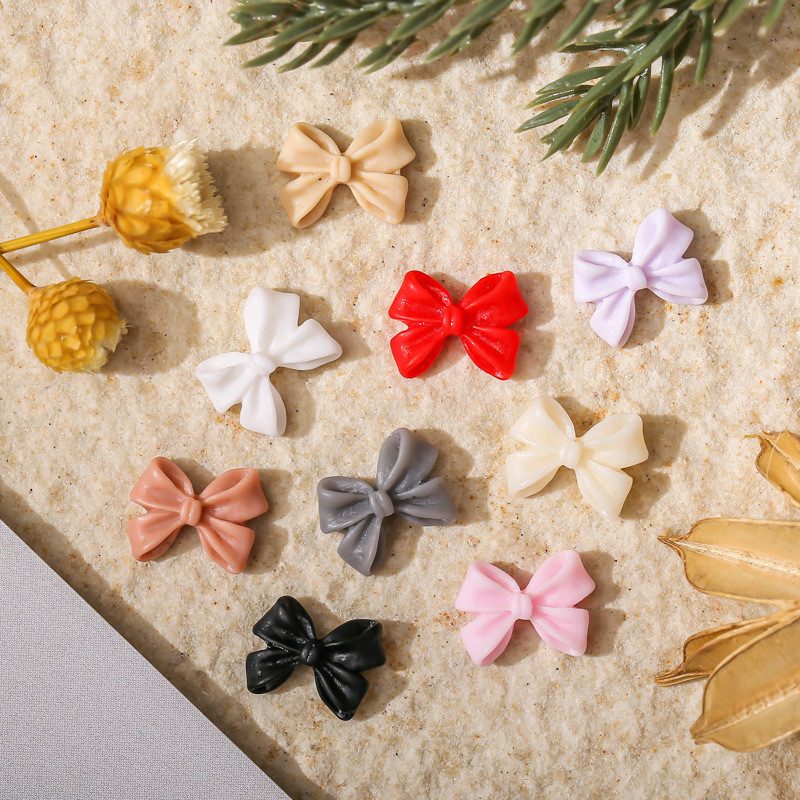 50db Kawaii Bow Resin Nail Art Charm 3D Bowknot Nyári Aranyos Dísz Ékszer Craft Csokornyakkendő Dekorációs Alkatrészek Manikűr 8,5*12,5mm