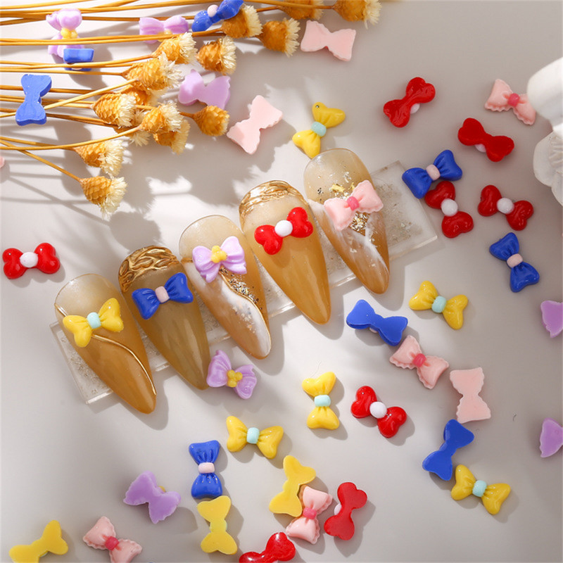 50db Macaron Bow Nail Deco Alkatrészek Mini Elegáns Japán Köröm Gyanta Tartozékok 3D Kawaii Fényes Manikűr Bowknot Charms Ékszer