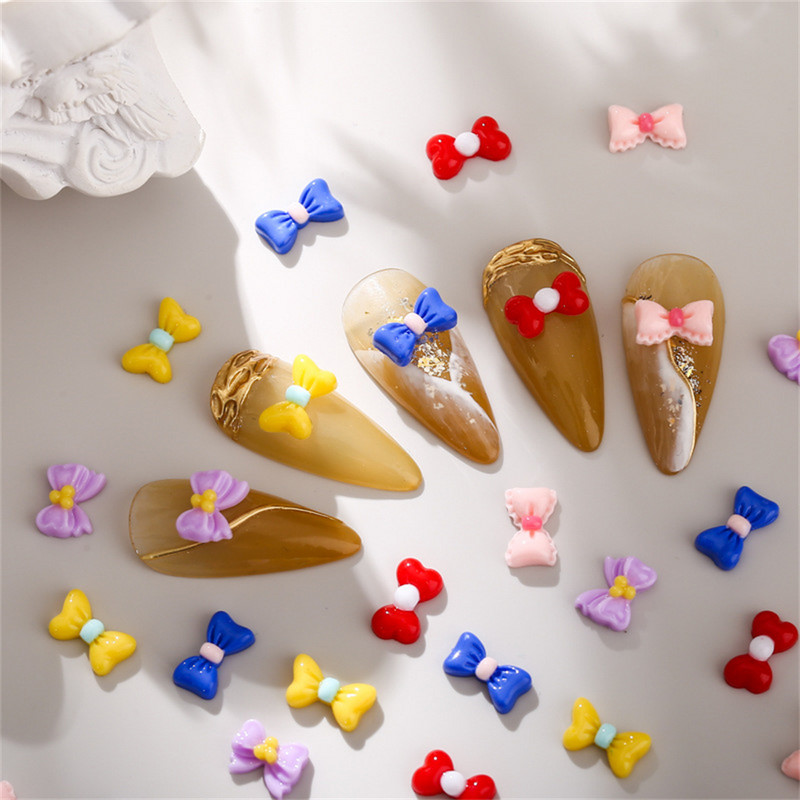 50db Macaron Bow Nail Deco Alkatrészek Mini Elegáns Japán Köröm Gyanta Tartozékok 3D Kawaii Fényes Manikűr Bowknot Charms Ékszer