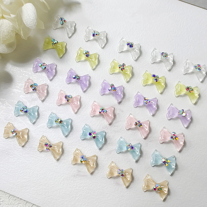 100 vnt Cool Summer Elf Jelly Clear Bow Knot Nagų pakabukai Symphony Mirksintis Elegantiškas peteliškės manikiūras puošia papuošalus nagų galiukų aksesuaras