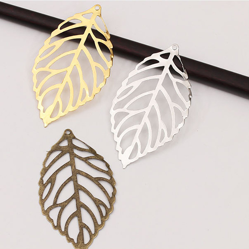 50 tk suur jätk ripats ehete tegemiseks, lehtedest kõrvarõngad, õõnsad hõljuvad filigraansed konnektorid, meisterdamise leiud