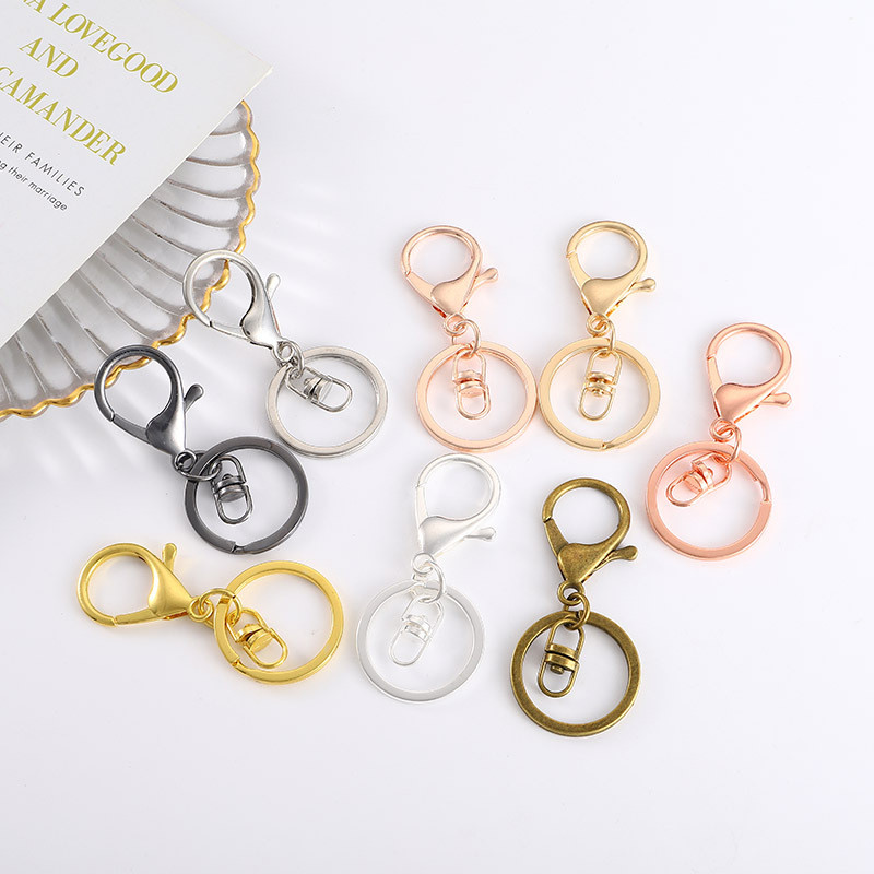 5 vnt/stal. Metalinis 30 mm raktų pakabukas, 70 mm ilgio omarų raktų pakabukas, skirtas papuošalams gaminti.