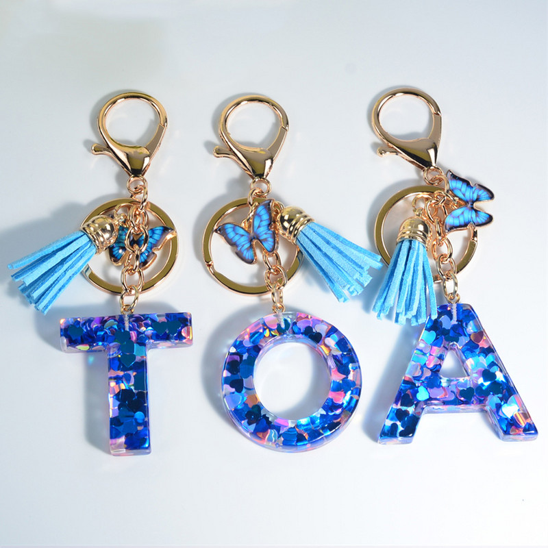 Modni akrilni privjesak s slovom i privjeskom u obliku plavog leptira, srce ispunjeno šljokicama, privjesci za ključeve s 26 inicijala za ženske ukrase torbice
