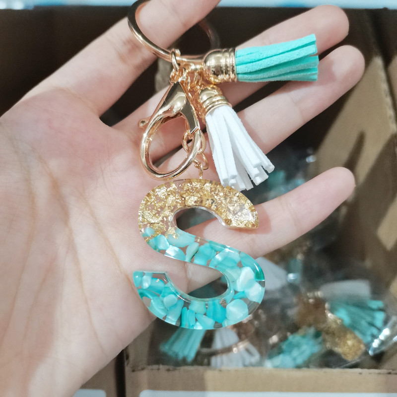 Brelocuri cu litere din rășină 26 de inițiale cu breloc din folie de aur Pandantiv de geantă pentru femei Brelocuri cu ciucuri cu alfabet Accesorii Cadouri