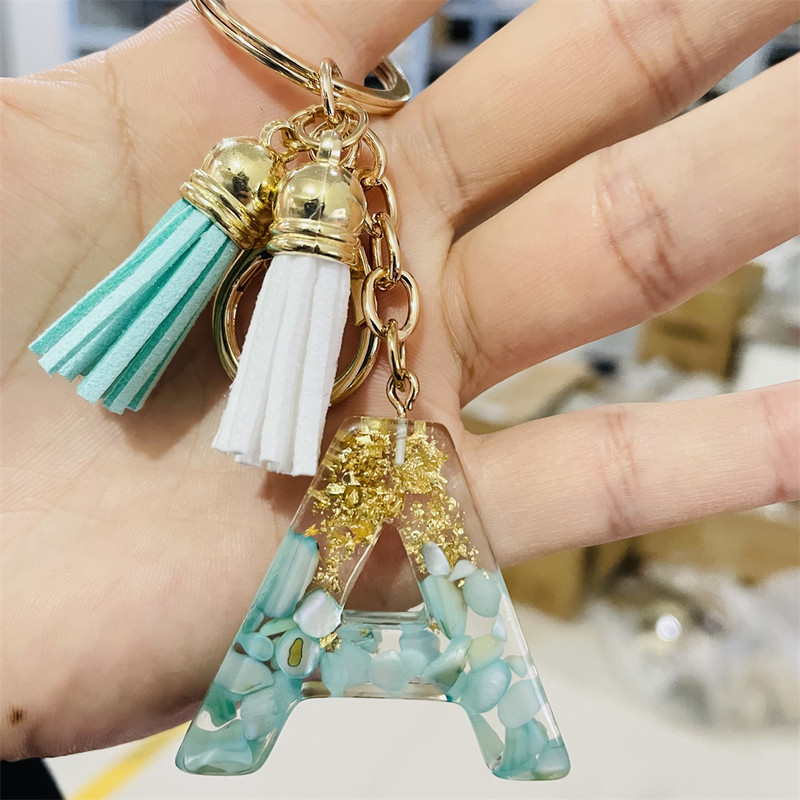 Brelocuri cu litere din rășină 26 de inițiale cu breloc din folie de aur Pandantiv de geantă pentru femei Brelocuri cu ciucuri cu alfabet Accesorii Cadouri