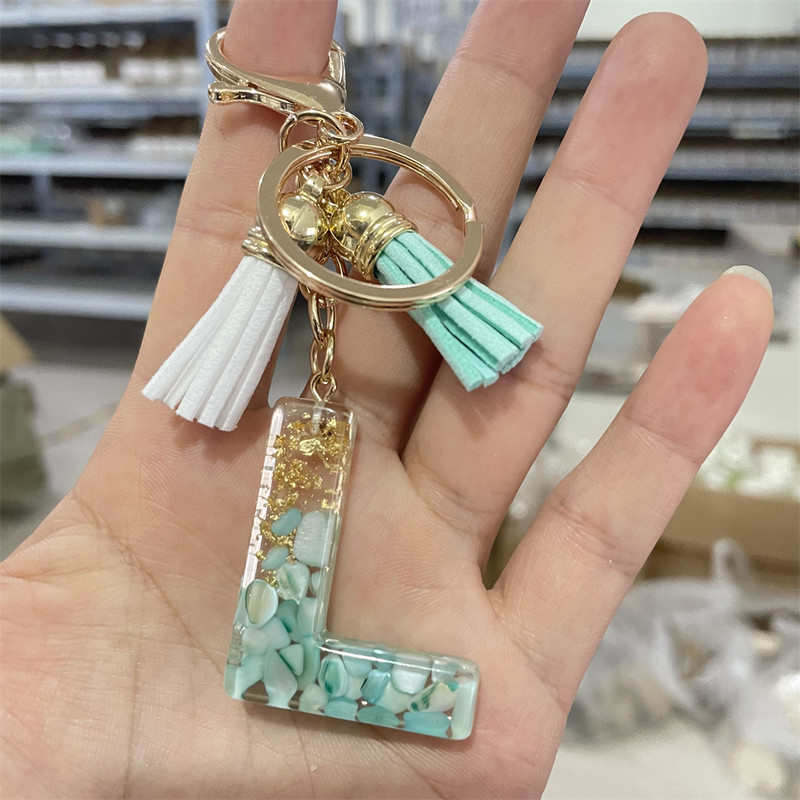 Brelocuri cu litere din rășină 26 de inițiale cu breloc din folie de aur Pandantiv de geantă pentru femei Brelocuri cu ciucuri cu alfabet Accesorii Cadouri