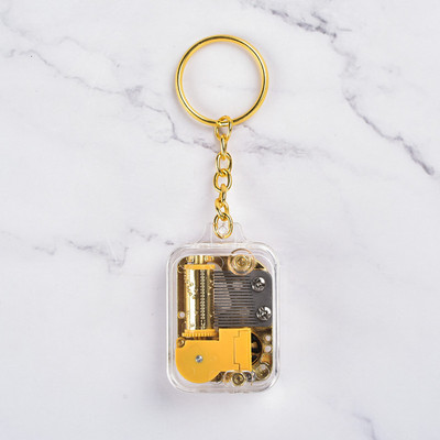 Mini apzeltīta kustība, kvadrātveida atslēgu piekariņa kulons mūzikas kaste Music Box dzimšanas dienas dāvana Radošas dāvanas un amatniecība