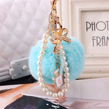 2022 Fashion Pearl Chain Crystal Bottle Bow Pompom Μπρελόκ αυτοκινήτου Γυναικεία Τσάντα χειρός Δαχτυλίδι μπρελόκ Αφράτο μπρελόκ μπρελόκ Κοσμήματα