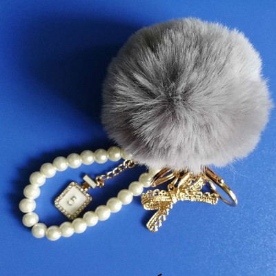 Autós Női kézitáska Kulcstartó Divat Gyöngy lánc Kristály Palack Íj Pompon Kulcstartó Bolyhos Puff Ball Kulcstartó Ékszer
