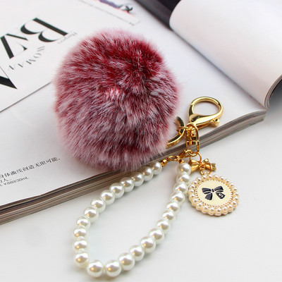 2022. Modni biserni lanac Kristalna boca Mašna Privjesak s pomponima Auto Ženska torbica Privjesak za ključeve Pahuljasta puf lopta Privjesci za ključeve Nakit