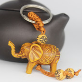 Állati elefánt kulcstartó őszibarack fafaragás Rich Lucky Animal kulcstartó medál női táskák Pom Pom Charm otthoni kulcstartók 1-3db