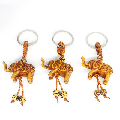 Állati elefánt kulcstartó őszibarack fafaragás Rich Lucky Animal kulcstartó medál női táskák Pom Pom Charm otthoni kulcstartók 1-3db