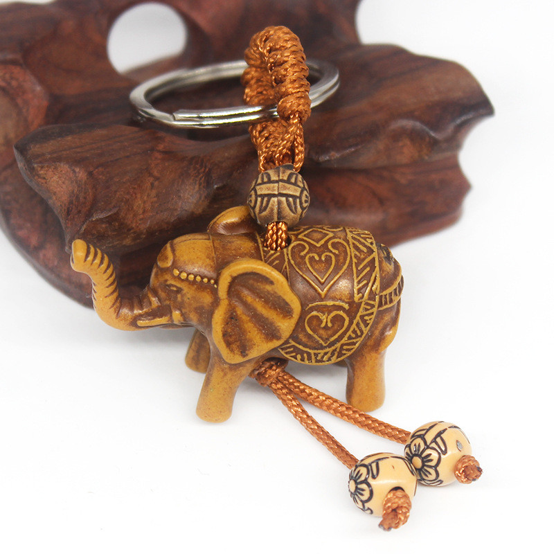 Állati elefánt kulcstartó őszibarack fafaragás Rich Lucky Animal kulcstartó medál női táskák Pom Pom Charm otthoni kulcstartók 1-3db