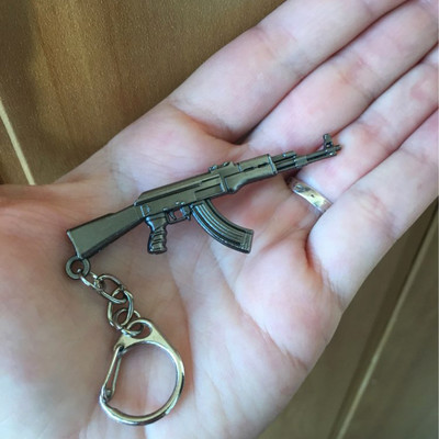 Férfi Counter Strike M4A1 AK47 pisztoly kulcstartó mesterlövész Awp CS GO kulcstartó gyűrűtáska autós csecsebecse Férfi ékszer buli ajándék-ajándékok