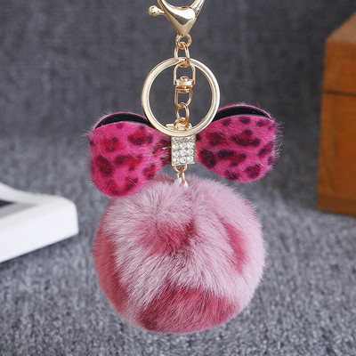Leopárdmintás masnis plüss kulcstartó női trendi nyúlszőrme golyós kulcstartó Női táska medál ékszer kiegészítők karácsonyi ajándékok