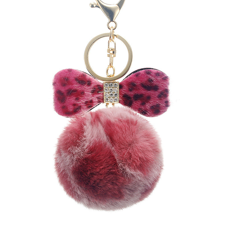Leopárdmintás masnis plüss kulcstartó női trendi nyúlszőrme golyós kulcstartó Női táska medál ékszer kiegészítők karácsonyi ajándékok