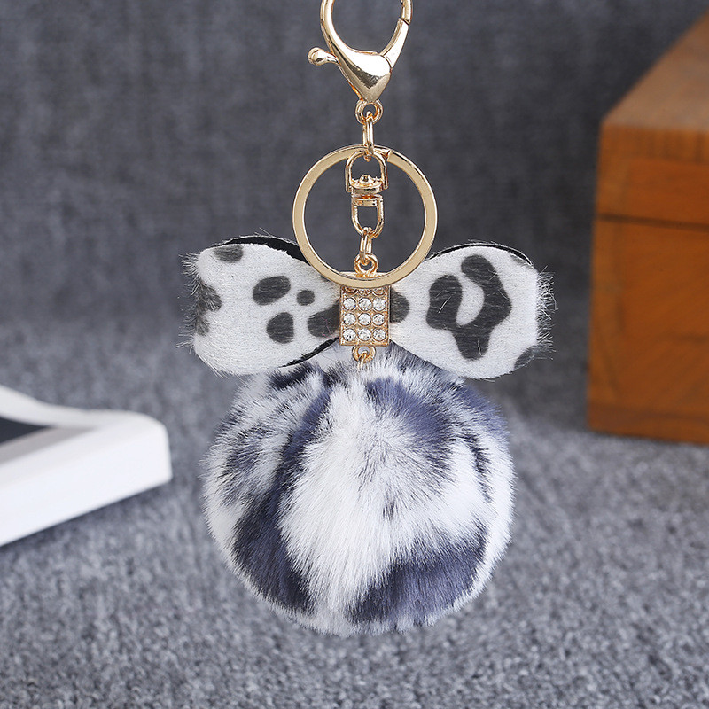 Leopárdmintás masnis plüss kulcstartó női trendi nyúlszőrme golyós kulcstartó Női táska medál ékszer kiegészítők karácsonyi ajándékok
