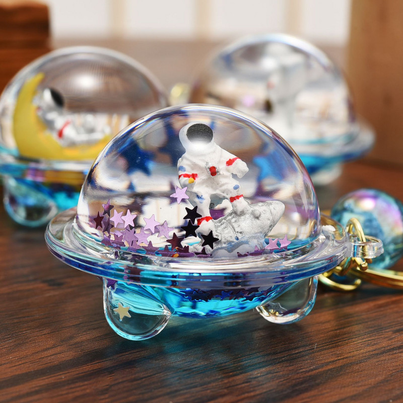 Astronaut creativ Oild farfurioară zburătoare Breloc lichid Desene animat Planetă plutitoare Rachetă Nisipuri mișcătoare Breloc cuplu Geanta Cadou Pandantiv