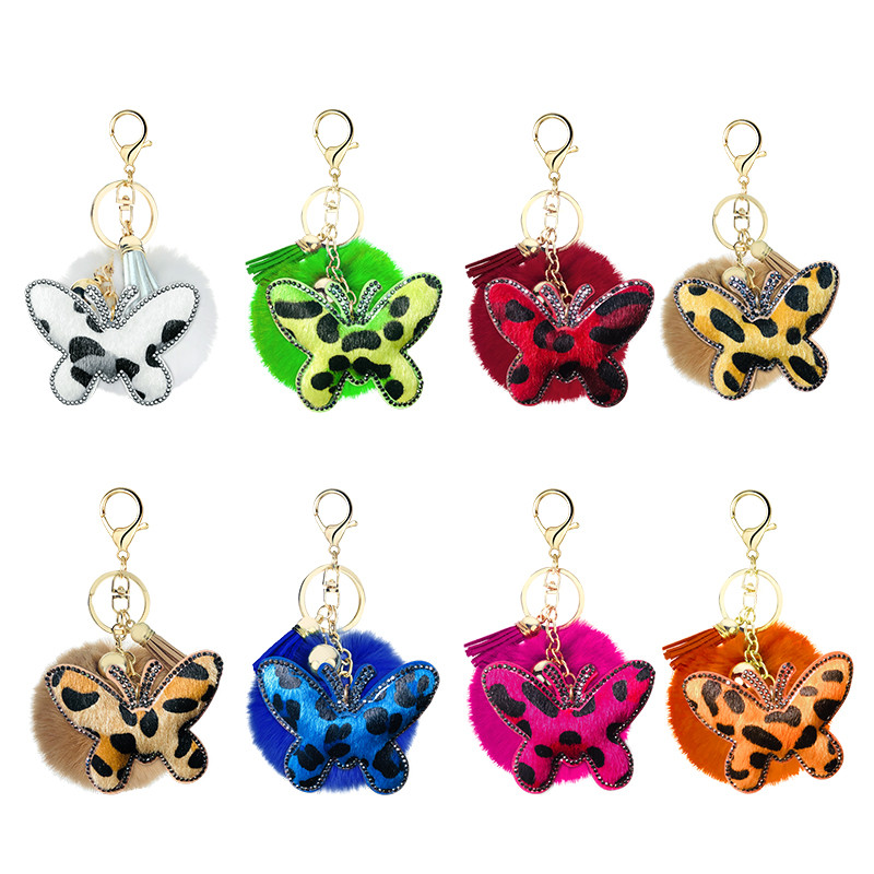 Breloc creativ mic cadou flanel cu imprimeu leopard cu strass, formă unică de fluture în formă de inimă, pandantiv cu bile de păr cu pompon de 8 cm