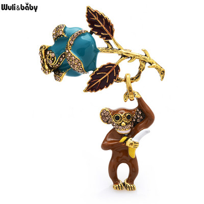 Wuli&baby Naughty Monkey Hold Rose Bross Női Uniszex 2 színű zománcozott Eat Banana Raise Virág Állatparti Brosstűk