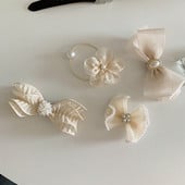 Elegáns sifon csípős hajtűcsavarok női gyöngyvirág rugalmas hajgumik Korea divatos fejdísz hajkiegészítők