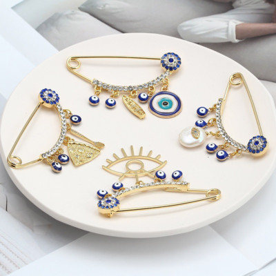 Jauna modes Lucky Eye Blue Turkish Evil Eye Vienkārša plaukstas piespraude Zelta krāsas sakausējuma piespraude sievietēm Vīriešu modes rotaslietas