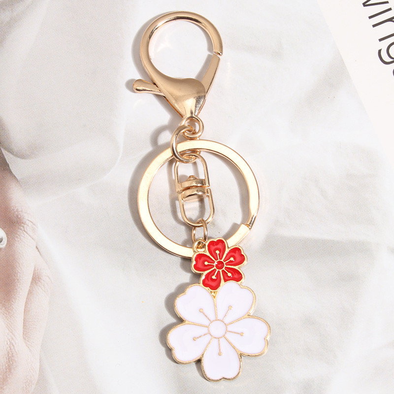 Breloc drăguț cu flori de Sakura Breloc emailat pentru femei, fete, accesoriu pentru geantă, pentru agățat mașină, cadou de bijuterii lucrate manual