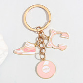 Roztomilý smaltovaný prívesok na kľúče Športová obuv Record Cat Headset Keyring Kľúčenka s mikrofónom Kľúčenky pre ženy Muži DIY Ručne vyrobené šperky Darčeky