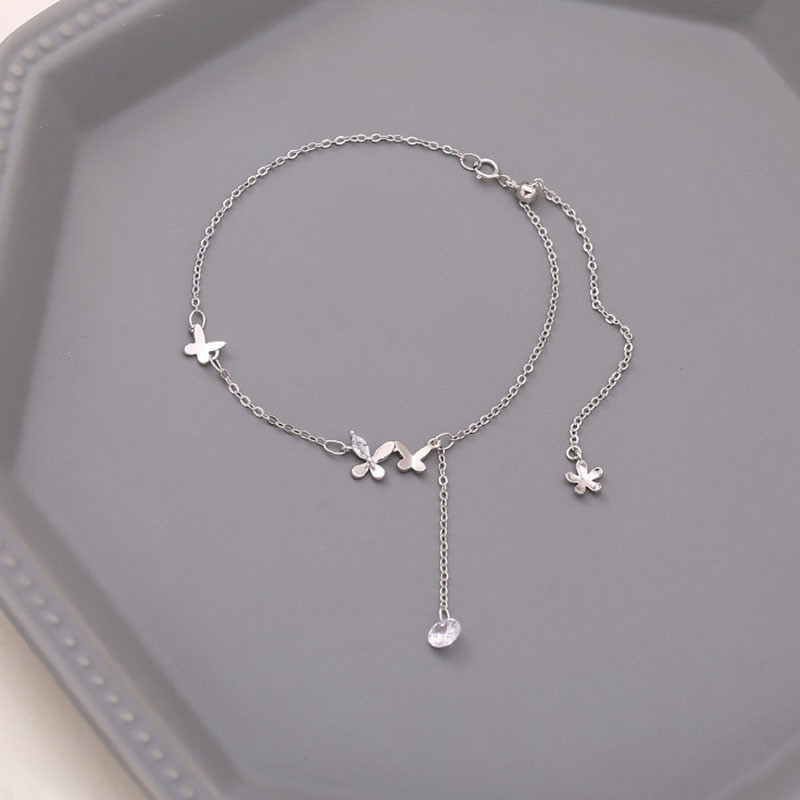 FOXANRY Strieborný farebný náramok na členok pre ženy Nový módny prívesok Jednoduchý motýľ Trblietavý zirkón Strapcové párty šperky Veľkoobchod