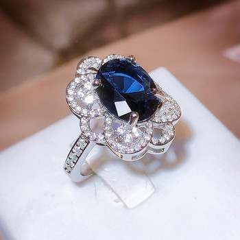 Κοσμήματα επετείου δώρου ντελικάτα διάτρητα λουλούδια οβάλ ζαφείρι με διαμάντια γυναικείο δαχτυλίδι με μπλε ζιργκόν