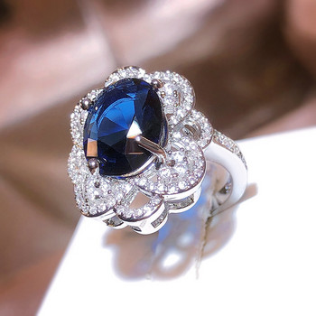 Κοσμήματα επετείου δώρου ντελικάτα διάτρητα λουλούδια οβάλ ζαφείρι με διαμάντια γυναικείο δαχτυλίδι με μπλε ζιργκόν