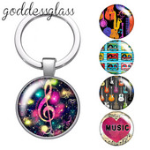 Love Music Guitar Notes hangszerek 25 mm-es üveg cabochon kulcstartó Táska Autós kulcstartó Gyűrűtartó Charms kulcstartók ajándék