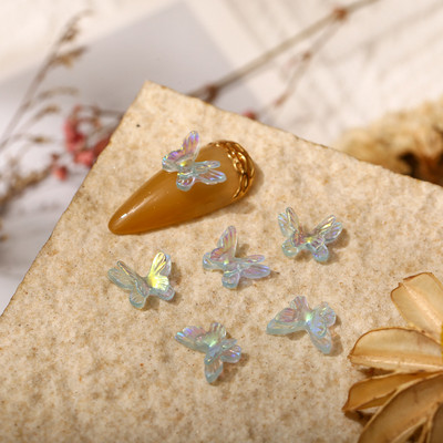 50 бр. Двоен нокът Aurora Bowknot орнаменти Aurora иридесценция AB смола покритие цветно стерео прозрачно свредло за нокти