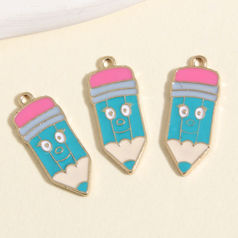 10 vnt. aukso spalvos 24x10 mm animacinių filmų emalio pieštukų pakabukai kreidelės pakabukas, tinkantis „pasidaryk pats“ kaklo papuošalai, rankų darbo priedai