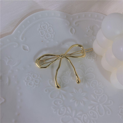 INS Hot Simple Bowknot Hajtű Arany Színű Fém Hollow Barrettes Eredeti Elegáns Hajtartozékok Hátsó Hajcsat Ékszer Ajándék