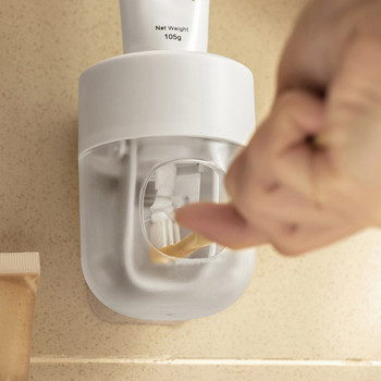 Матова изстисквачка за паста за зъби Висящ на стената автоматичен дозатор за туба Стойка за съхранение на паста за зъби Тоалетна Комплект аксесоари за баня