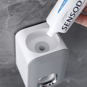 Διανομέας οδοντόκρεμας Αυτόματη βάση αξεσουάρ μπάνιου Στίφτης για τη σκόνη χωρίς τρυπητή βάση