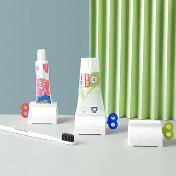 Εγχειρίδιο Multifunction Toothpaste Squeezer Dispenser οδοντόκρεμας Φορητή βάση στήριξης καθαριστικού προσώπου Προμήθειες μπάνιου