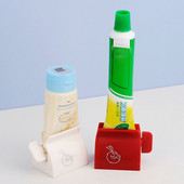 Изстисквачка за паста за зъби без пробиване Стойка за четки за зъби Детска дозатор за паста за зъби Стенен преса за продукти за грижа за кожата