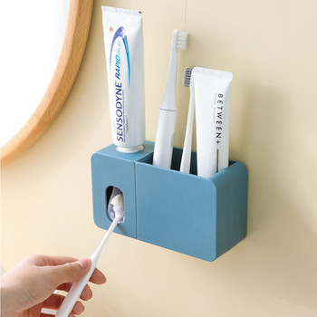 Βάση τοίχου Αυτόματη Στίφτης οδοντόκρεμας Στήριγμα οδοντόβουρτσας με προστασία από τη σκόνη Σχάρα αποθήκευσης μπάνιου Αξεσουάρ μπάνιου
