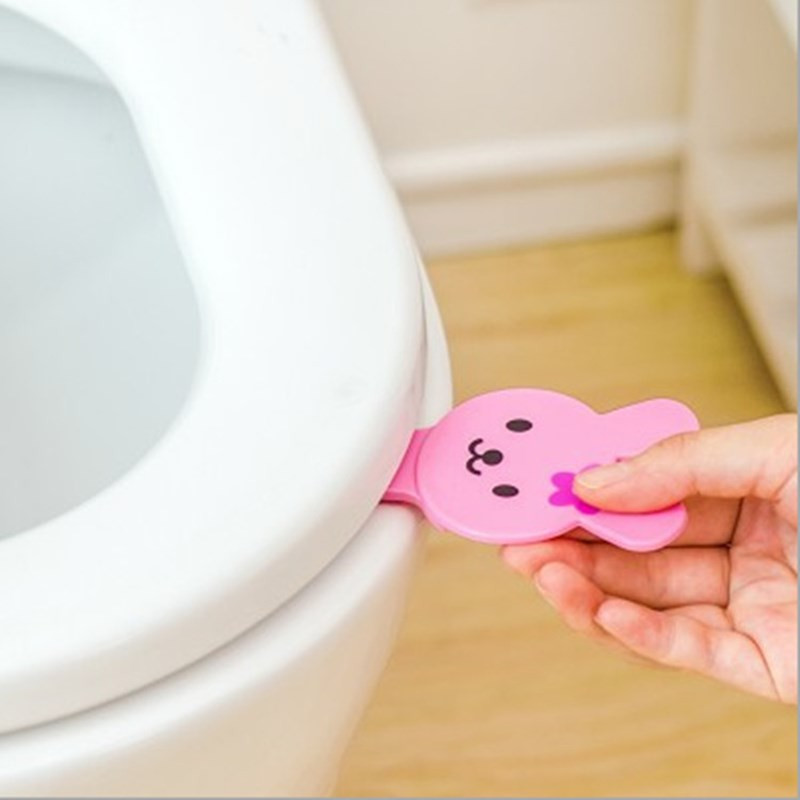 Animacinių filmų tualeto dangčio pakėlimo rankena apverčiama rankena nuo nešvarumų sanitarinė uždaroji tualeto sėdynės dangčio pakeliama rankena, skirta kelionei namo vonios kambario įrankiui