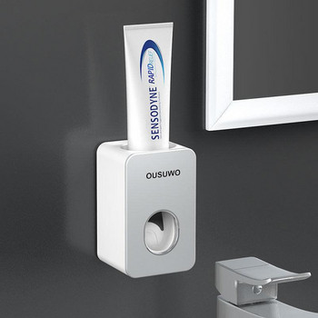 Държач за четка за зъби Автоматичен дозатор за паста за зъби Прахоустойчива лепкава засмукваща монтирана на стена изстисквачка за паста за зъби за баня