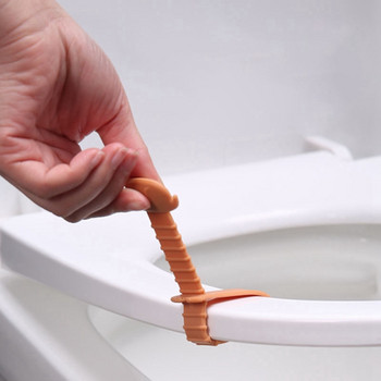 Σιλικόνη Αντι-βρώμικο ανυψωτικό τουαλέτας Κάλυμμα καθίσματος ντουλάπι υγιεινής Λαβή αυτοκόλλητο Συσκευή ανύψωσης Αξεσουάρ μπάνιου σπιτιού