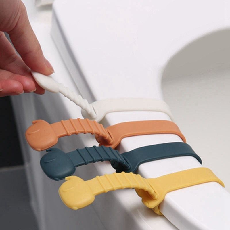 Tualetes vāka pacēlājs Silikona sēdekļa paceļamā lente Vannas istabas piederumi Atkārtoti lietojami, izturīgi mājas biroja viesnīcām