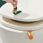 1 kom. Pramčani poklopac za WC školjku Silikonski podizač poklopca za WC školjku Podizač poklopca ručke za kupaonicu u kućanstvu Neprljava ručka Podizač poklopca za artefakt