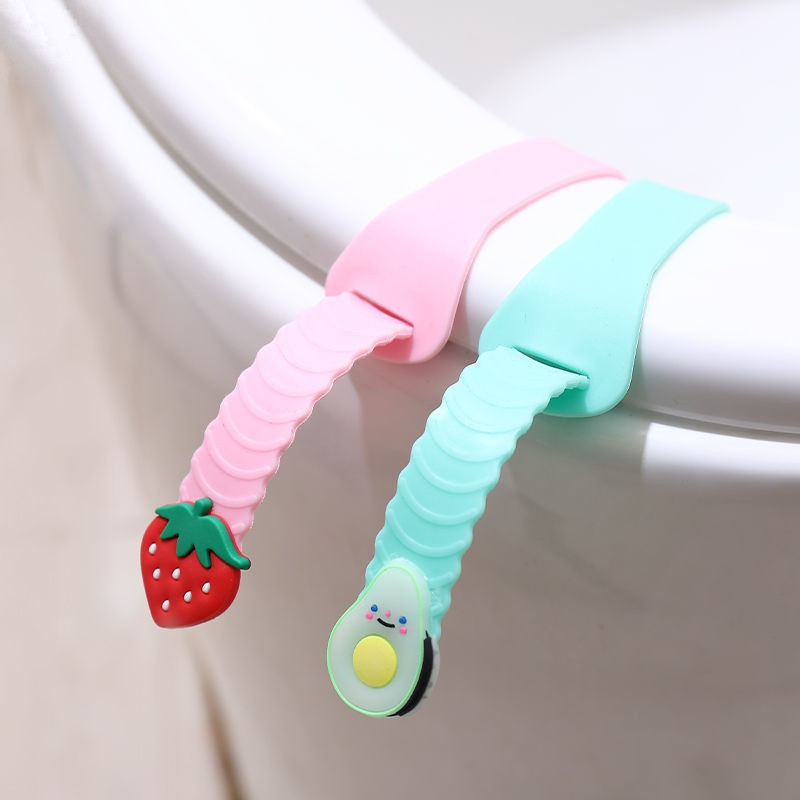 2 gab Cute Fruit tualetes sēdekļa pārsega pacēlājs silikona sanitārais Closestool sēdekļa pārsega pacelšanas rokturis ceļojumu vannas istabas pacelšanas ierīcei