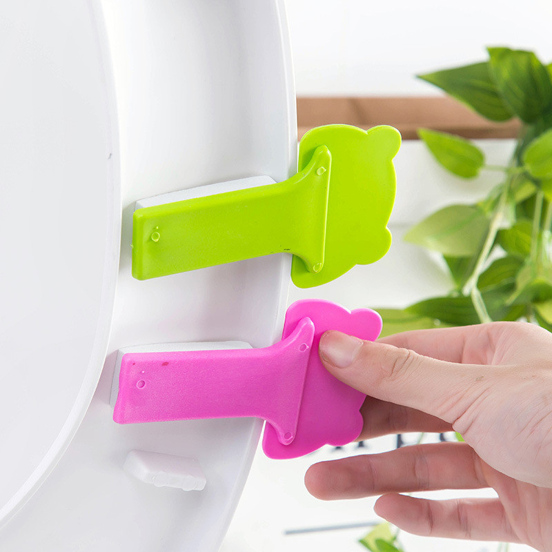 1 gab Cute Cartoon tualetes pārnēsājama tualetes vāka rokturis tualetes vāka pacelšanas instruments tualetes piederumi