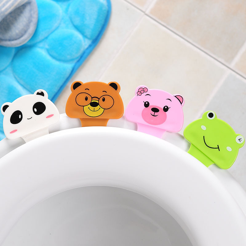 1 gab Cute Cartoon tualetes pārnēsājama tualetes vāka rokturis tualetes vāka pacelšanas instruments tualetes piederumi