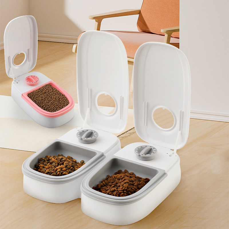 Lolojumdzīvnieku automātiskā laika padeves ierīce Lielas ietilpības sausās barības trauks Elektriskais suņu padevējs Divkāršā trauka bļoda kaķiem Suņiem Mājdzīvnieku piederumi