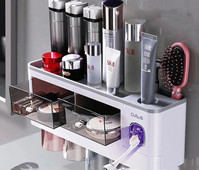 Vannas istabas piederumu komplekts Magnētiskās adsorbcijas apgriezts zobu birstes turētājs Automātisks zobu pastas dozators spiedes uzglabāšanas statīvs